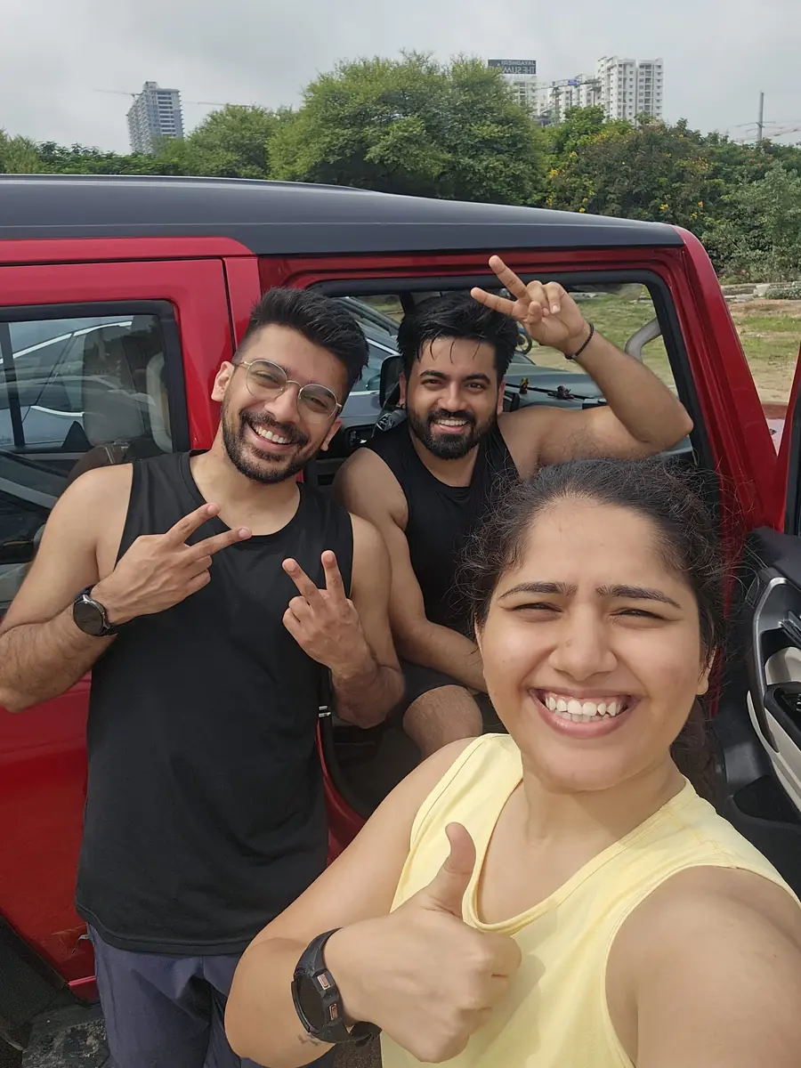 Three M³RC runners celebrating by the car after the Sunday long run