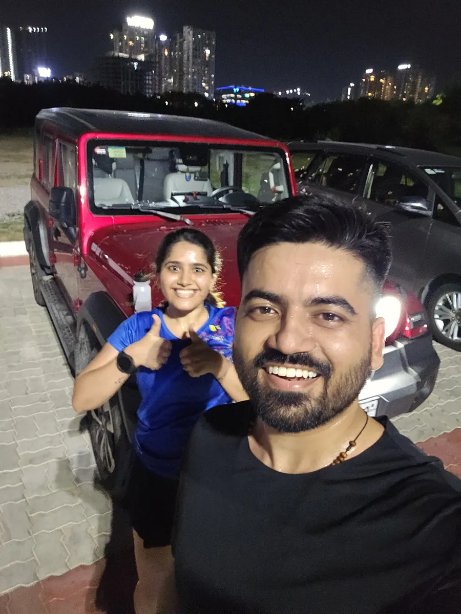 Two M³RC runners with the city skyline behind them